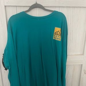 Long sleeve t-shirt. Teal with lettering. Tag still attached. Size 3X